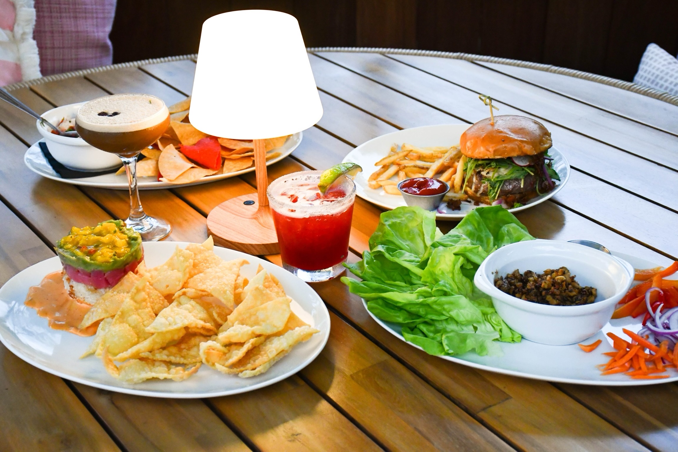 A spread of shareables, cocktails and The Standard burger