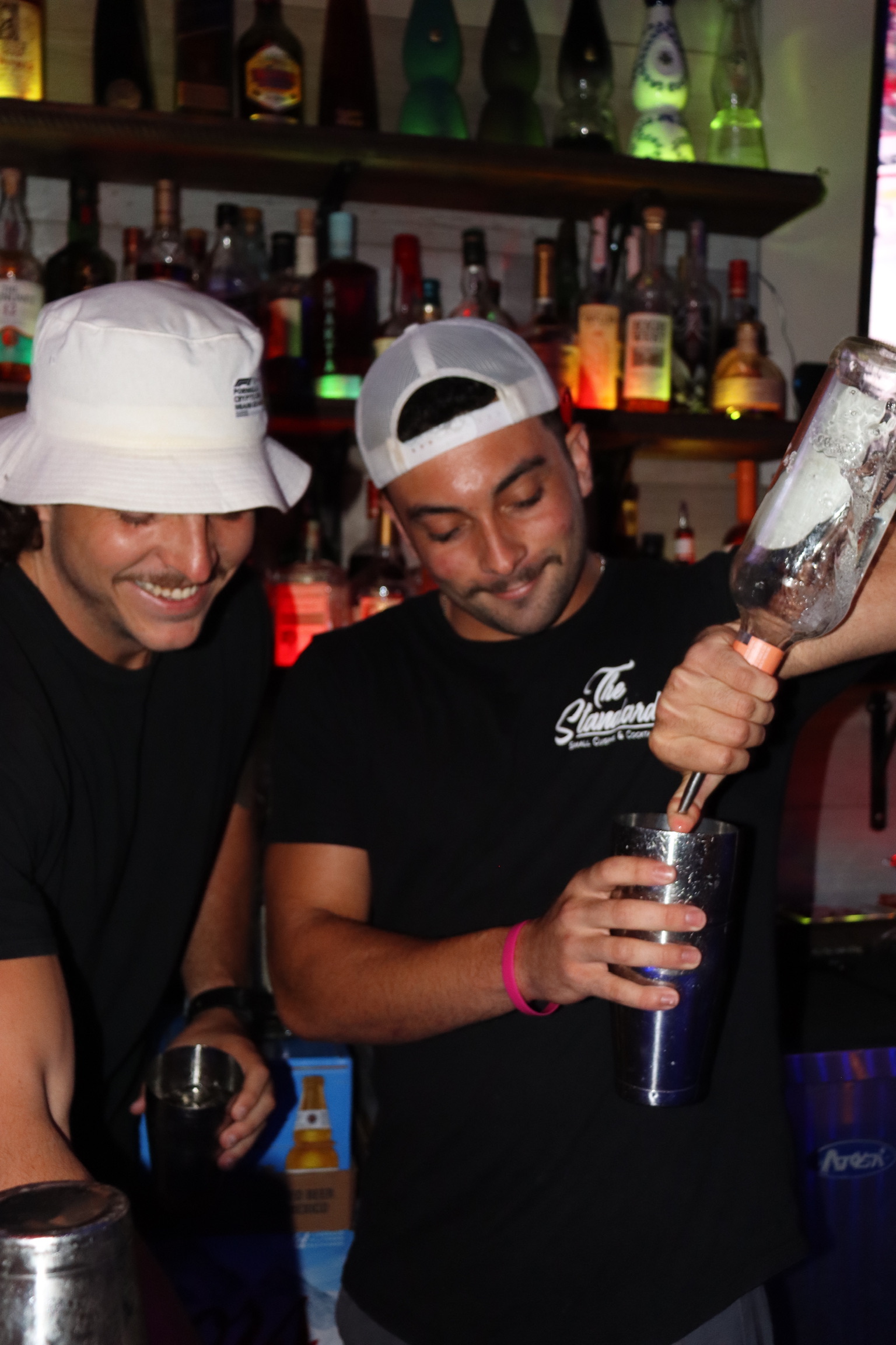 Bartenders pouring cocktails at The Standard Boca Raton